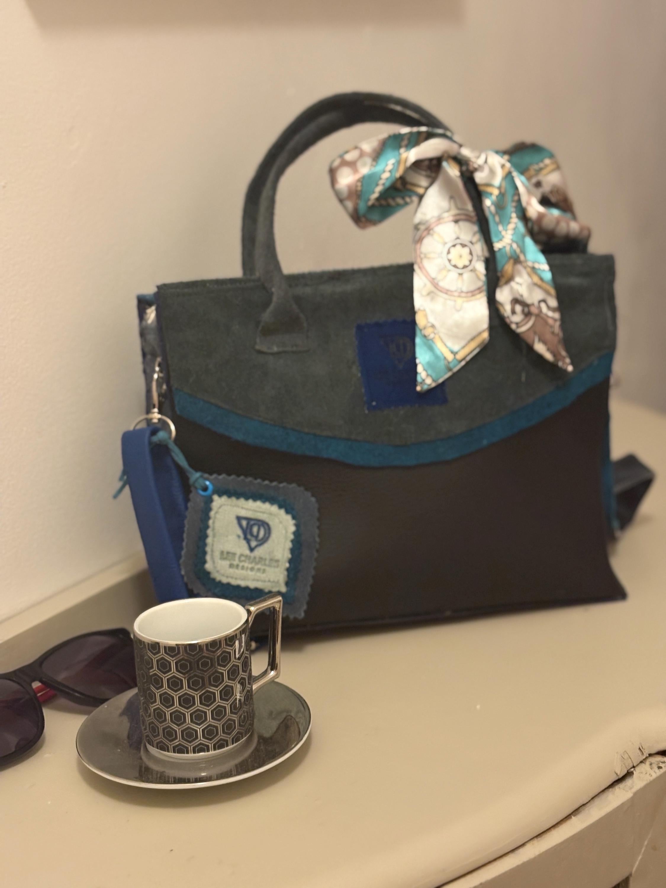 Fabulous bag by a new up and coming designer Lee Charles, gorgeous tote in black and blues