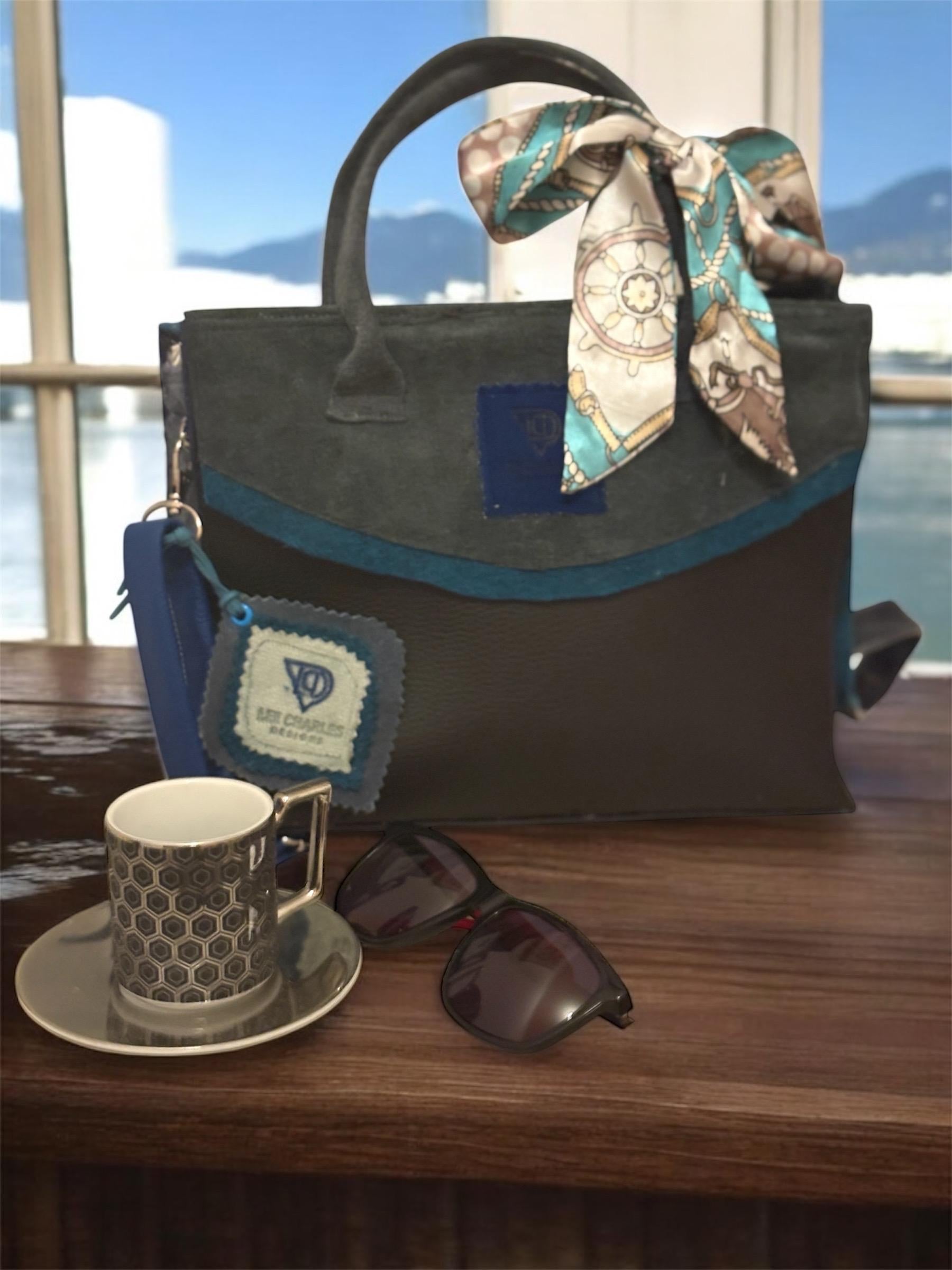 Fabulous bag by a new up and coming designer Lee Charles, gorgeous tote in black and blues