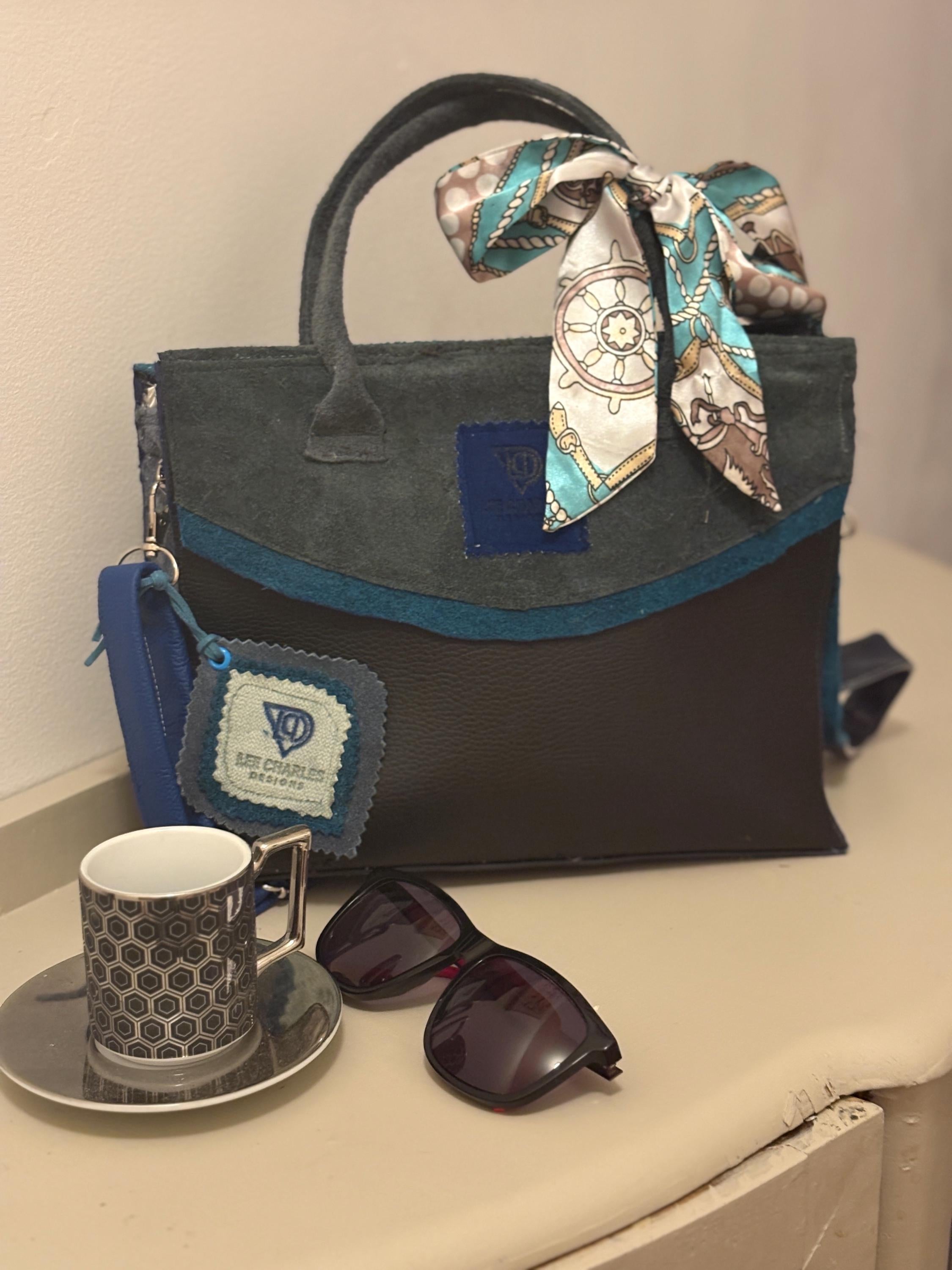 Fabulous bag by a new up and coming designer Lee Charles, gorgeous tote in black and blues